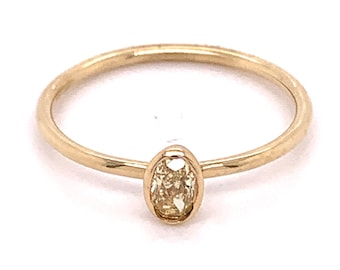 14k Yellow Gold  with a  .18ct Oval Fancy Yellow