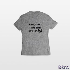 May include: Gray t-shirt with the text "SORRY, I CAN'T I HAVE PLANS WITH MY CAT" and a black cat silhouette.