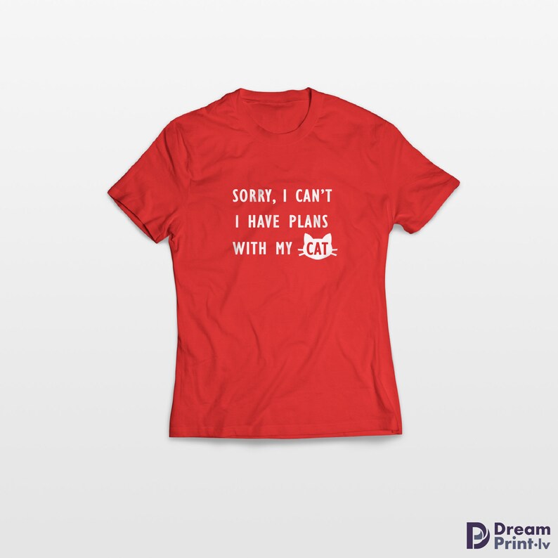 May include: Red t-shirt with white text that reads "SORRY, I CAN'T I HAVE PLANS WITH MY -CAT-" with a cat face icon.