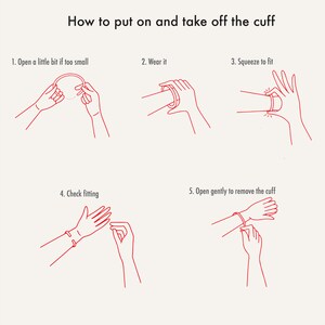 May include: An instructional graphic titled How to put on and take off the cuff, featuring five red line-art illustrations demonstrating steps: 1. Open a little bit if too small, 2. Wear it, 3. Squeeze to fit, 4. Check fitting, 5. Open gently to remove the cuff.