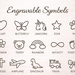 May include: A chart titled Engravable Symbols displaying fifteen black line art icons including a heart, butterfly, unicorn, star, paw, flower, teddy bear, rainbow, infinity sign, footprints, cross, airplane, dinosaur, train, and a bow.