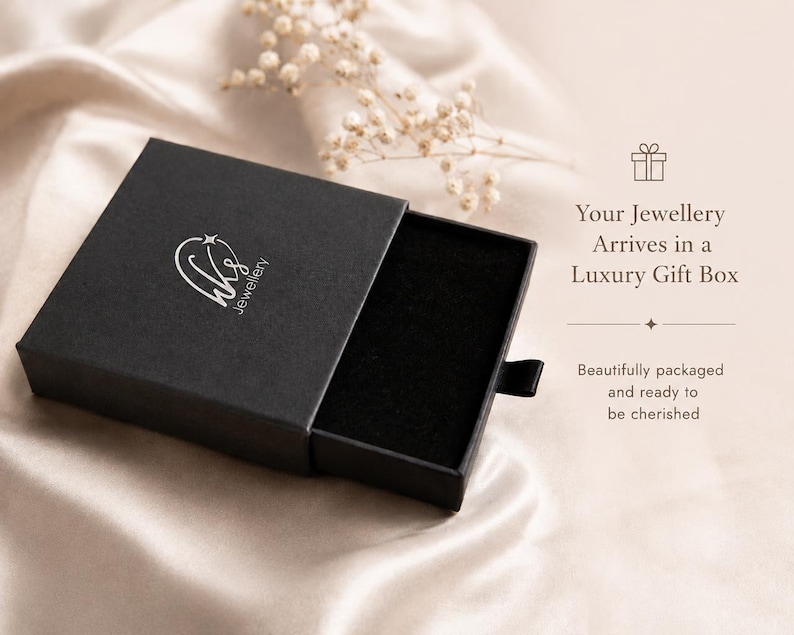 May include: A black square jewelry gift box with a sliding drawer, featuring a white logo with the text wks jewellery on the lid. The box includes a black velvet insert and text that reads: Your Jewellery Arrives in a Luxury Gift Box.