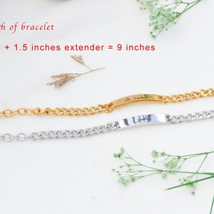 May include: Two chain bracelets, one gold-toned and one silver-toned, each featuring a central flat metal bar with Arabic calligraphy. The text on the image states: Total length of bracelet 7.5 inches + 1.5 inches extender = 9 inches.