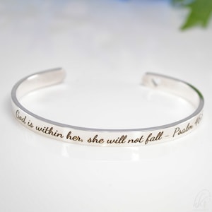 May include: Silver bangle bracelet inscribed with the words "God is within her, she will not fall - Psalm 46".
