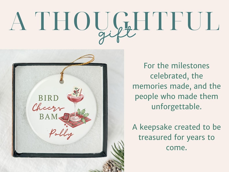 May include: A round white ceramic ornament with a gold hanging string, presented in a black box. The ornament features a graphic of a cocktail glass, a small book, and holly, with the text BIRD CHEERS BAM and the name Polly printed on it.