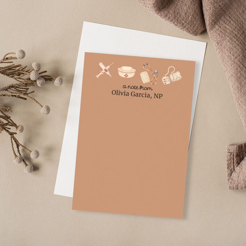 May include: A light brown note card with a note from Olivia Garcia, NP. The card is decorated with a nurse's cap, a stethoscope, a syringe, a bandage, and a blood pressure cuff.