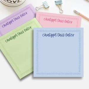 May include: A collection of colorful sticky notes in pastel shades of purple, pink, green, and blue. Each note features the text "chatgpt this later" in a handwritten style font, with a decorative border.