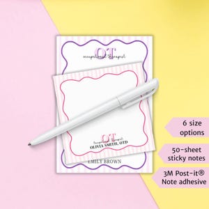 May include: A stack of two sticky note pads with a white pen. The top pad has a pink and white striped border with the text "OT occupational therapist" and "OLIVIA SMITH, OTD". The bottom pad has a purple border and the text "EMILY BROWN".