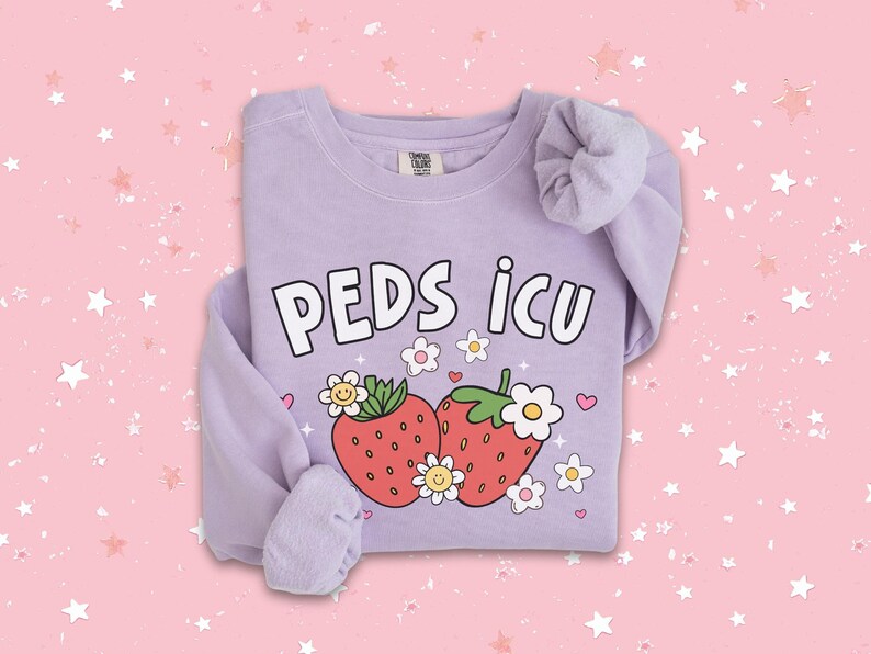 May include: Purple sweatshirt with the text "PEDS ICU" and a graphic of two strawberries with flowers and smiley faces.
