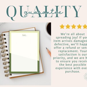 May include: A notepad with a green and cream color block design, resting on a spiral-bound notebook. The notepad has the initials "S.G." printed on it. The word "QUALITY" is at the top of the image.