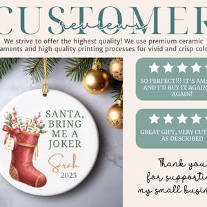 May include: A round white ceramic ornament featuring a red Christmas stocking filled with Mahjong tiles and pink flowers. The text reads: SANTA, BRING ME A JOKER, Sarah, 2025. The ornament hangs by a gold string and is displayed with customer reviews.