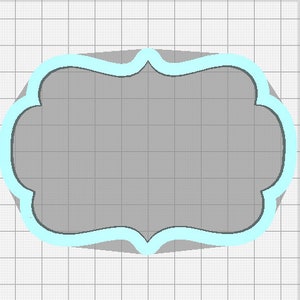 May include: A light blue and gray decorative frame with a scalloped edge. The frame is empty and ready for text or images.
