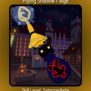 May include: Amigurumi crochet pattern for a Flying Shadow Mage. The mage is a black and blue bag with a red symbol on the front. The mage is holding a yellow magic wand with snowflakes around it. The background is a night scene with a building in the distance. Skill Level: Intermediate.