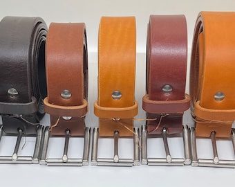 May include: Eight leather belts in different colors, including black, brown, tan, and yellow, with silver buckles.