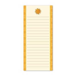 May include: A rectangular notepad with a cream-colored background and horizontal lines for writing. The top features a smiling sun illustration. The sides are bordered with a repeating orange floral pattern. A cheerful and practical stationery item.