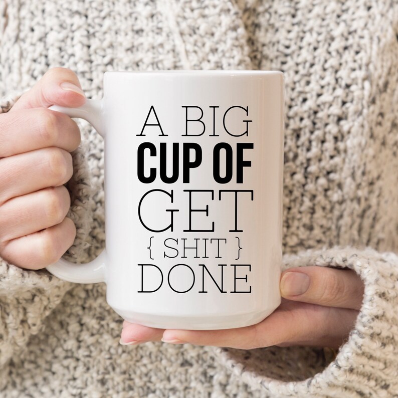 May include: White ceramic mug with black text that reads "A big cup of get {shit} done".