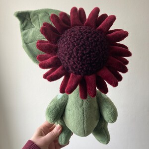 Dark red sunflower flora folk doll