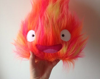 Peluche mediano de Calcifer Feliz - El Castillo Ambulante de Howl