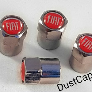 May include: Set of four silver chrome valve stem caps with a red Fiat logo.