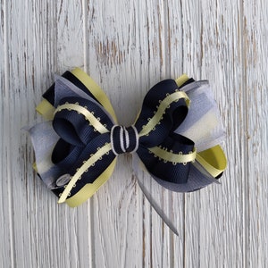 Fiocco per capelli combinato: fiocco in grosgrain, organza e raso