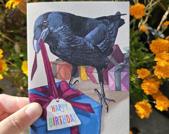 Raven wrapping gifts for a birthday A6 birthday greeting card