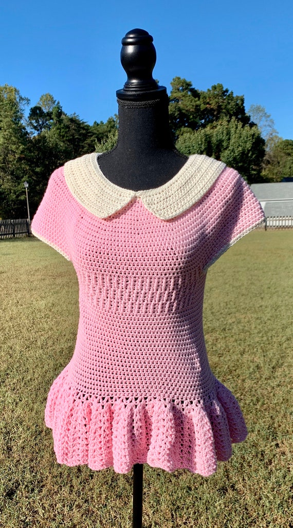 Pink top peplum sweater