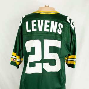 Puede incluir: Camiseta de fútbol verde y amarilla con el nombre "LEVENs" y el número "25" en la espalda.