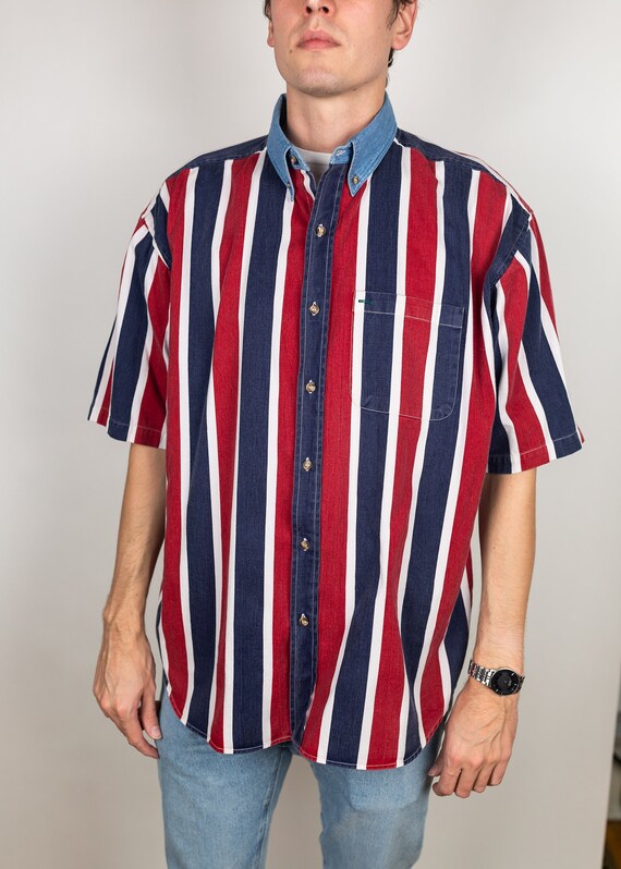 Get down and get FUNKY in this 1970s body-hugging short-sleeve stretch shirt with extra-funky collar and contrast red buttons Medium