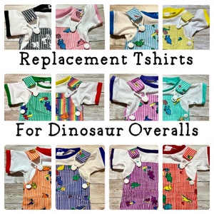 May include: Replacement T-shirts for Dinosaur Overalls.  The image shows 10 different t-shirts in various colors, including white, pink, blue, yellow, green, purple, and orange. Each t-shirt has a different dinosaur design.
