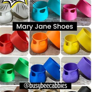 May include: A collection of Mary Jane shoes for Cabbage Patch Kids in various solid colors including white, teal, pink, red, orange, yellow, green, blue, purple, brown, tan, and black. The text reads: Over 600 sold! Best shoes for Cabbage Patch Kids.