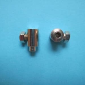 May include: Two silver metal cable end stops with a threaded nut on one end and a round end on the other.