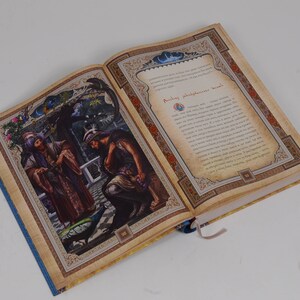 May include: An open book with colorful illustrations and text. The left page features a detailed painting of figures in ornate clothing, a peacock, and a garden setting. The right page has text within a decorative border.