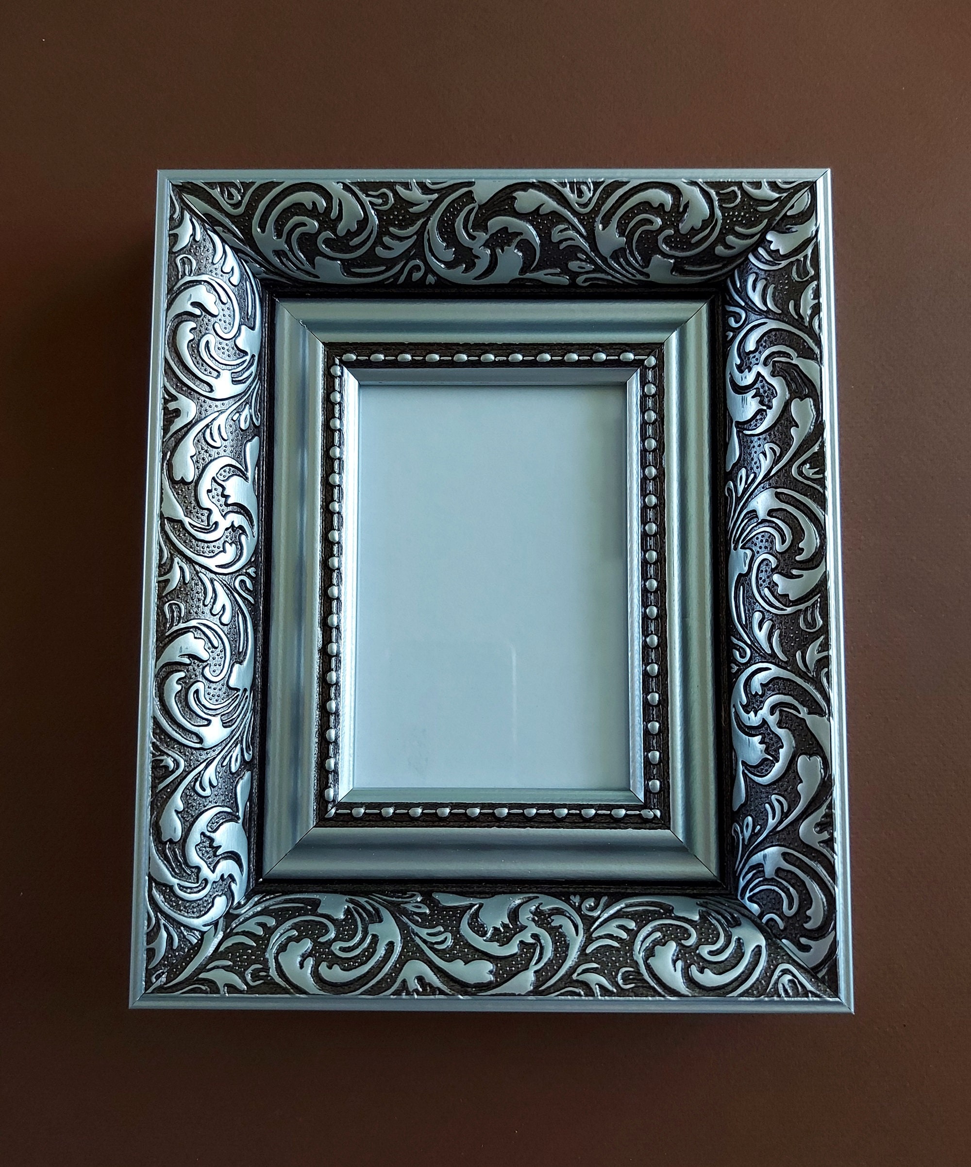 Marco portafoto de plata 20x30 cm fotografía bilaminada