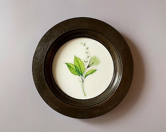 Size 3 - 16 inches,circular dark brown frame,frame on the wall