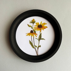 May include: A framed illustration of a bouquet of yellow and brown wildflowers with green stems and leaves.