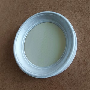 May include: White round picture frame with a raised edge and a smooth, white interior.