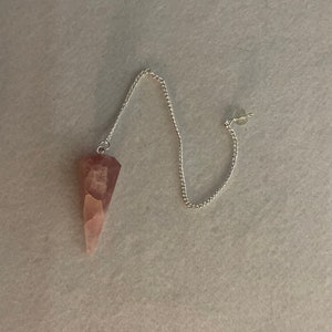 This beautiful Rose Quartz Pendulum is  1.75” and with chain is 8.50”