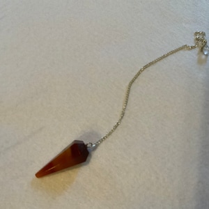 This beautiful Carnelian Pendulum is  1.25” with chain 9”