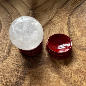 Crystal Clear Quartz crystal ball/sphere is 3.2 oz with the wooden stand.