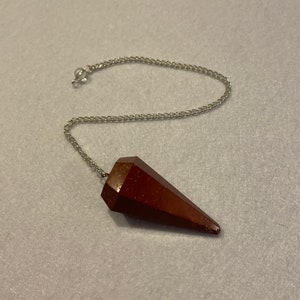 Beautiful Red Jasper Pendulum is 1.75” with chain 9.25”.