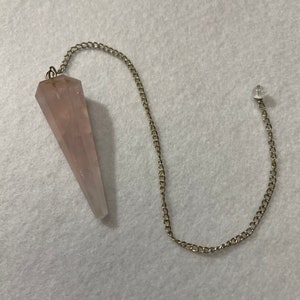 This beautiful Rose Quartz Pendulum is  1.75” and with chain is 8.75”
