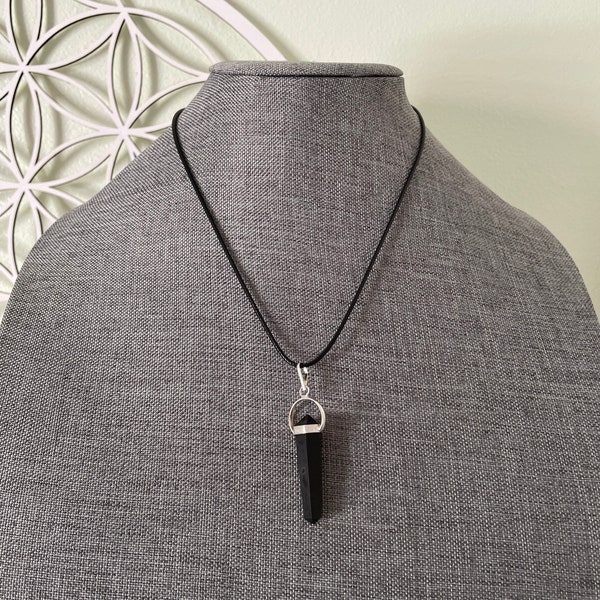 Beautiful black obsidian point pendant necklace wrapped in silver on a black nylon cord