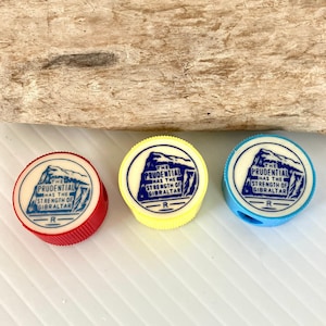Set of 3 Vintage Prudential Insurance Strength of Gibraltar Pencil Sharpeners - Red, Yellow, Blue - Advertising Promo - 1in. Diameter