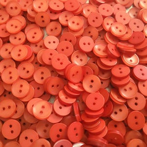 50 Iridescent Orange Buttons, size 10mm, 16L, round, flat back, 2 holes, matching bulk button pack