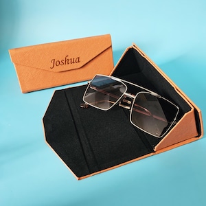 Étui à lunettes pliable avec fermeture magnétique. Étui pour lunettes de soleil et lunettes portable triangulaire rigide en cuir PU, anti-rayures, unisexe.