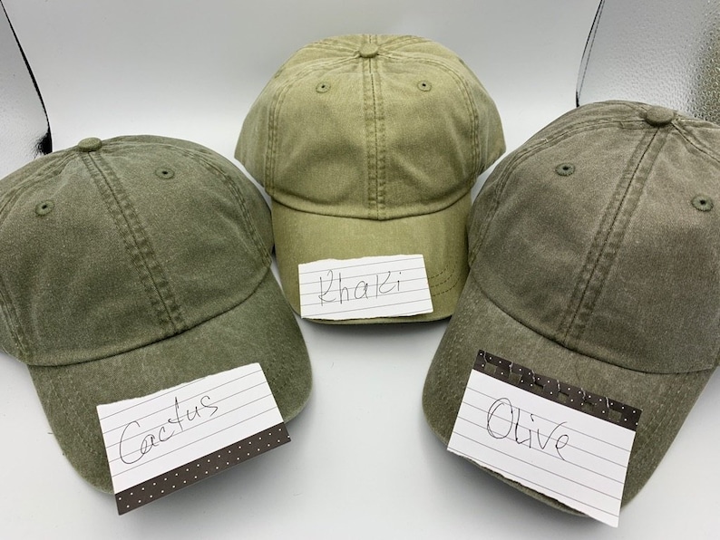 May include: Three baseball caps in different shades of green. The caps are labelled "Cactus", "Khaki", and "Olive".