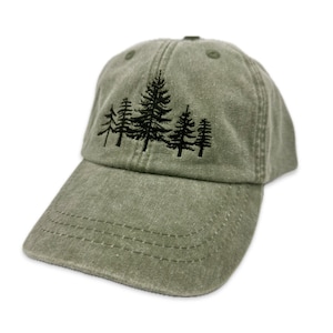 May include: A green baseball cap with an embroidered design of four black pine trees.