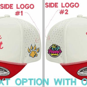 May include: A white and red snapback cap featuring a red embroidered script text that reads Your Text on the front. The side panels have perforated detailing. One side displays a yellow paw print, while the other shows a circular Flappy's Wings logo.