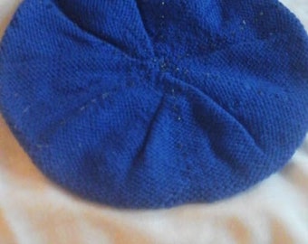 May include: A blue knitted beanie hat.