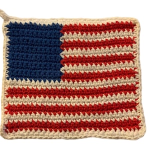 May include: Crocheted American flag pot holder in red, white, and blue.